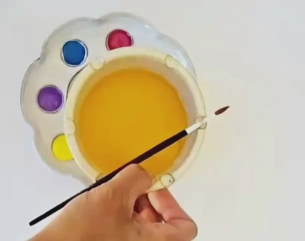 Watch this handcrafted ceramic paint palette and rinse bowl set in action—featuring a petal-shaped palette with eight wells, a spacious mixing area, and a coordinating rinse bowl with brush rests for seamless painting.
